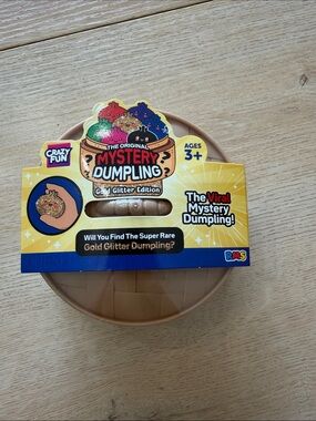 Five below Mystery Dumpling Gold Glitter Edition Toy - UNOPENED NWT